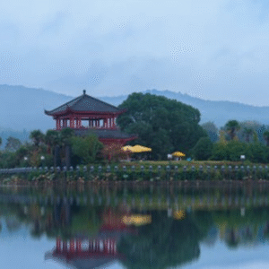 Peaceful lakeside temple with mountain reflection